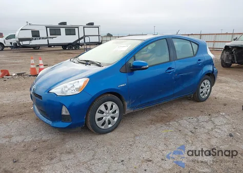 2014 Toyota Prius C One from USA, damaged, VIN JTDKDTB39E1083614